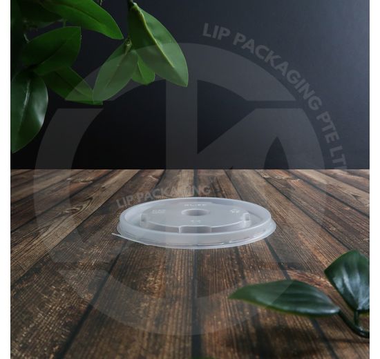 Stack of 100mm flat, clear plastic lids (FL260) ready to seal small paper food containers (260ml).