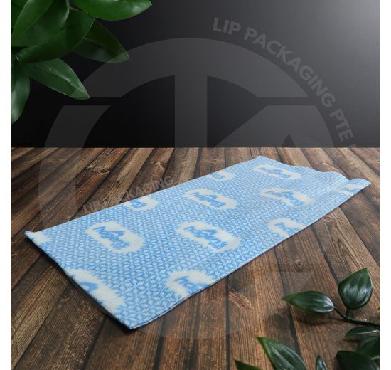 Close-up view of a blue and white patterned Hagen's reusable disposable kitchen cloth towel.