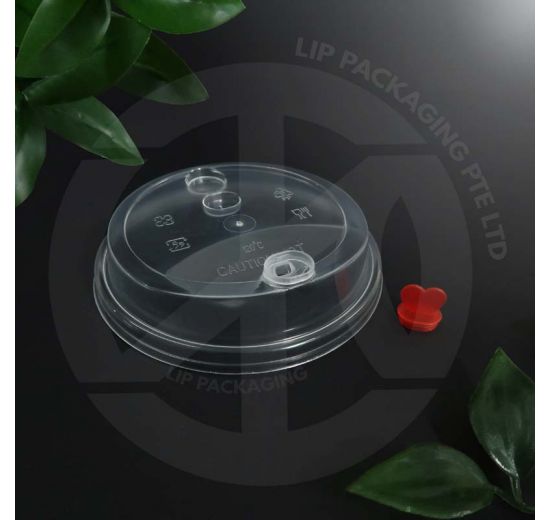 Translucent hard plastic lid with a unique heart-shaped cap closure for beverage cups.