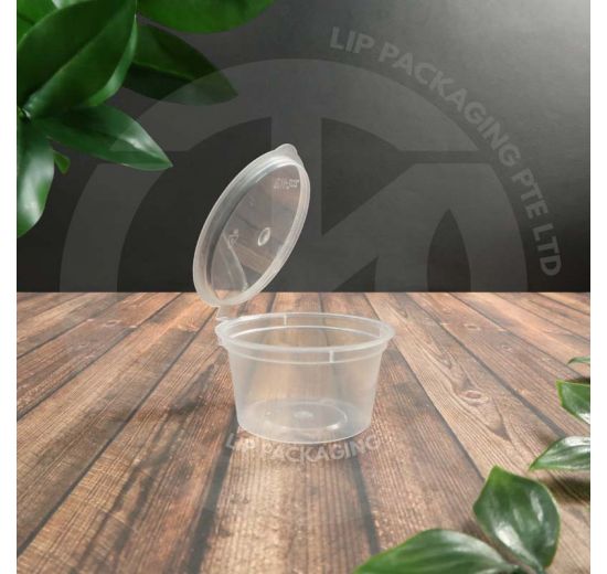 Transparent, microwave-safe 50ml round plastic sauce cup (MS TP200K) with a hinged lid.