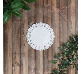 Stack of white round paper doyley papers with decorative lace edge, various sizes displayed.