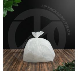 Stack of packaged white plastic trash bags, 19 inches by 19 inches, suitable for small office bins.