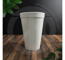 A white 16oz Styrofoam cup displayed next to a compatible plastic lid, emphasizing the large size for coffee or tea.