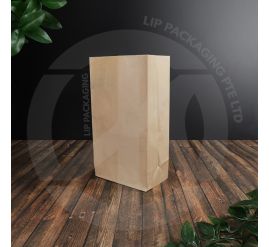 Stack of unbleached Kraft brown SOS paper bags, model S04, showing the flat, stable base.