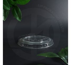 Stack of transparent 93mm Flat Lids F93 for 12oz PET disposable beverage cups.